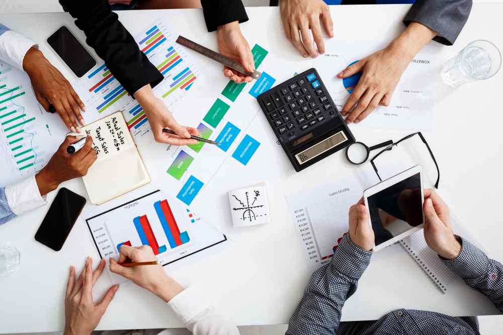 businessmen-hands-white-table-with-documents-drafts(1)